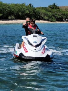 Boy a dad on Jet Ski